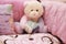 Baby girl crib and teddy bear