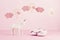 Baby girl cute pink shoes and unicorn over the pink pastel background