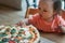 Baby girl eating pizza in italian restaurant, Healthy, unhealthy food, children`s fast food.