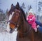 Baby girl horseback riding