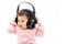 A baby girl listens music with headphone with hands