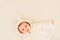 Baby girl lying on a white bed, adorable looking at camera