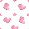 Baby girl newborn seamless pattern. Pink baby booties with pompons. Motherhood and childhood vector icons background.