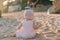 Baby girl play on sandy beach and sunset light