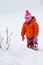 Baby girl playing in the snow