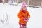 Baby girl playing in the snow