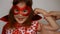 Baby girl plays superhero. Funny child in a red raincoat and mask playing power super hero. Superhero and power concept