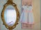 Baby girl`s dress hanging on vintage pink shutter