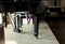 Baby girl\'s legs under the piano