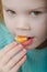 Baby girl vegetarian with mandarin slice