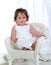 Baby Girl on Wicker Chair