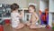 Baby group children playing toys animals on the floor in kindergarten. Happy family kid concept. Baby twins play toys