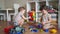 Baby group children playing toys on the floor in kindergarten. Happy family kid concept. Baby twins brother sister play