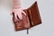 Baby hand and wallet, close-up. Children fingers and an object on a white background