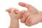 Baby holds mother`s finger hand, trust family help concept, isol