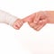 Baby holds mother\'s finger, trust family help concept