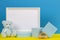 Baby kid toy background with blank white wooden mock up frame, educational toys and geometric shapes podium platforms