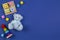 Baby kids toys background. Blue teddy bear, stacking pyramid tower, shape color recognition puzzle stacker and colorful