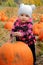 Baby with large pumpkin