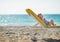 Baby laying on sunbed on beach