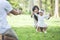 Baby learn to walk with their parent in the park