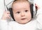 Baby listening music on back