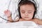 Baby listening to music with headphones