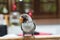 Baby lovebird standing on the perch on blurred background in the