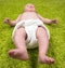 Baby Lying on Green Carpet