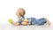 Baby Lying on White Floor, Child Back Rear View Looking Away