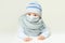 Baby in medical protective face mask on white