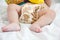 baby in modern eco stacks of cloth diapers and replacement bushings selective focus close-up on bright background