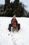 Baby and mom sledding