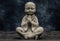 Baby monk praying statuette