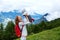 Baby and mother with the Alps mountains in nature in the Background