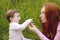 Baby and mother outdoor grass playing park