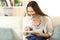 Baby and mother reading a book together