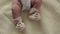 Baby Moves by Feet in Funny Socks. 4k Ultra HD