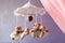 Baby music mobile carousel with little bears. Toy carousel, above the baby bed. Baby bedroom close up element