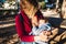 Baby naps while being breastfed by his mother outdoors