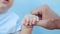 Baby newborn holding a dad hand. kid dream concept. close-up baby hand grabs the finger of the father hand. newborn baby