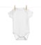 Baby onesie hanging on clothes line against white background
