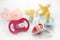 Baby pacifier set over white background