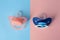 Baby pacifiers on color background, above view