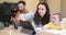 Baby and parents busy in a digital gadgets during a lunch at home