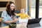 Baby and parents busy in a digital gadgets during a lunch at home