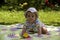 Baby on the picnic carpet in grass