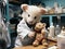 Baby pig doctor examines teddy bear