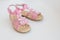 Baby pink sandals isolated on white background.Pair of fashion denim baby shoes for the toddlers feet. Kids leather