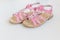 Baby pink sandals isolated on white background.Pair of fashion denim baby shoes for the toddlers feet. Kids leather